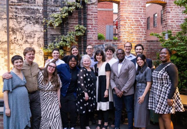 Image: The staff of Mid Atlantic Arts celebrate Theresa Colvin, center. Credit: Micah E. Wood.