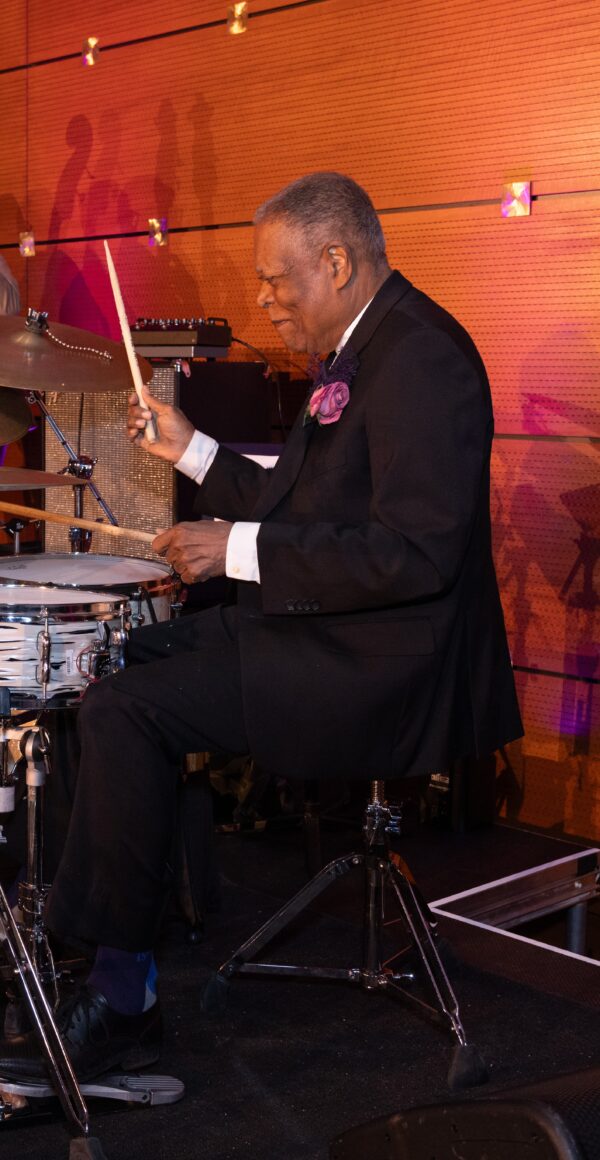 Color photo of Billy Hart playing the drums.