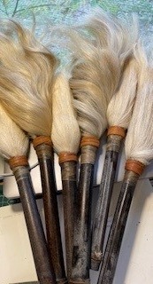 Six cow tail switches.