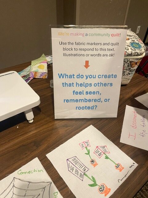 A quilt making station with information for attendees.